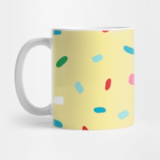 Colorful sprinkles on yellow melting icing Mug